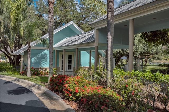 view of exterior entry with a porch