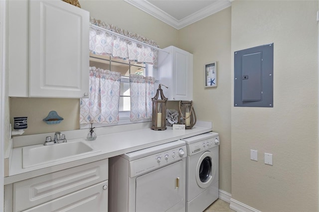 laundry area featuring washing machine and dryer, cabinets, sink, electric panel, and crown molding