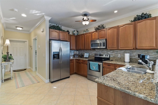 kitchen featuring decorative backsplash, sink, stainless steel appliances, light stone counters, and light tile patterned flooring