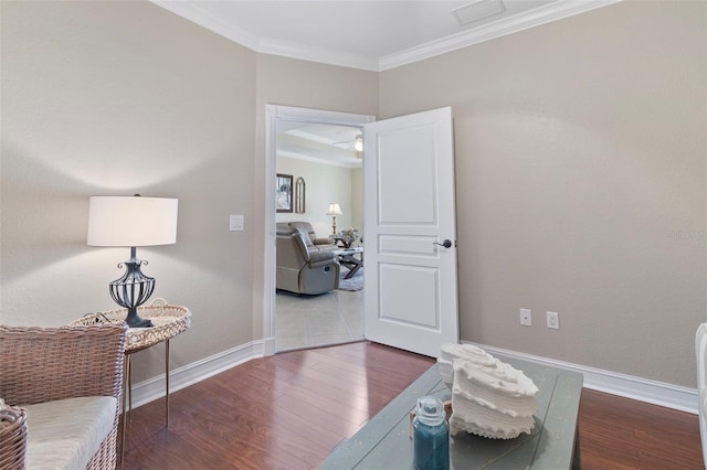 interior space with dark hardwood / wood-style floors and ornamental molding