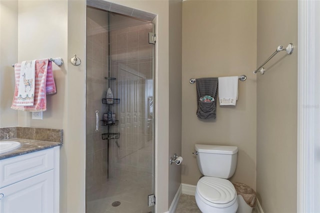 bathroom featuring a shower with door, toilet, tile patterned flooring, and vanity