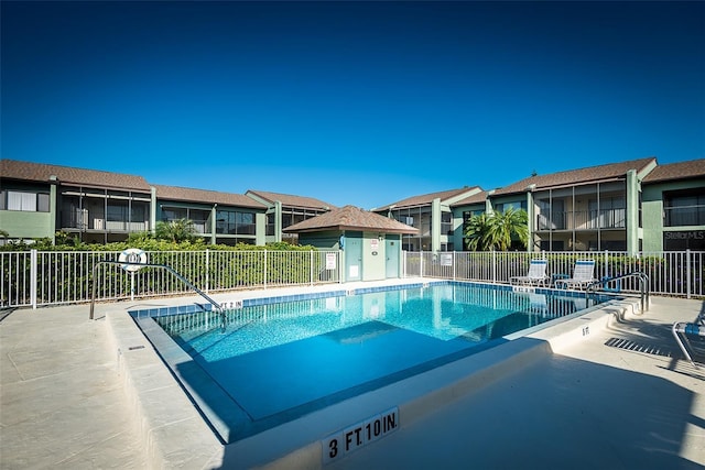 view of swimming pool with a patio