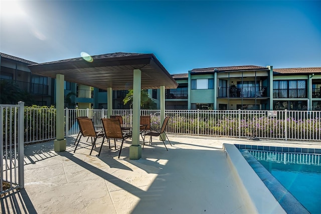 view of swimming pool featuring a patio