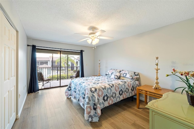 bedroom featuring ceiling fan, access to exterior, a closet, and light hardwood / wood-style flooring