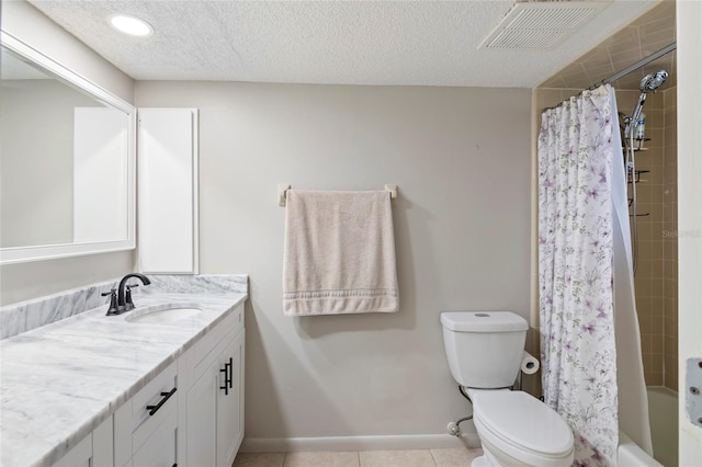 full bathroom with tile patterned floors, toilet, a textured ceiling, vanity, and shower / bath combination with curtain