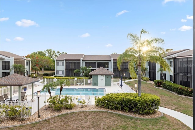 view of swimming pool featuring a gazebo and a yard