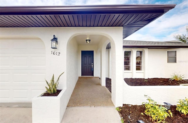 doorway to property featuring a garage