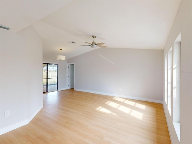 empty room featuring vaulted ceiling, ceiling fan, and light hardwood / wood-style floors