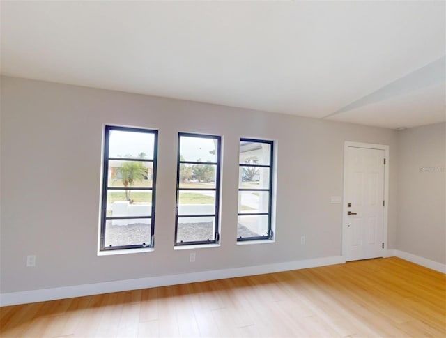 unfurnished room featuring hardwood / wood-style floors