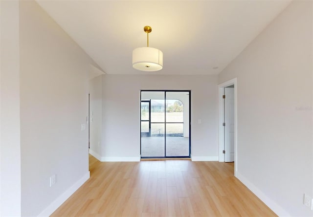 unfurnished room featuring light hardwood / wood-style floors