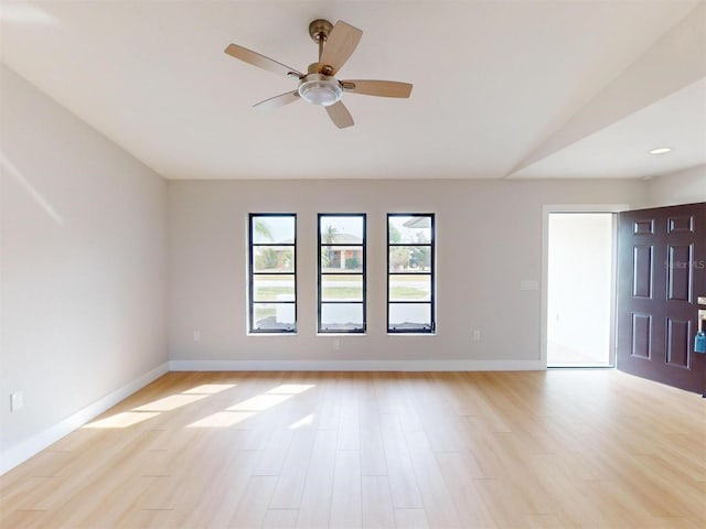 unfurnished room with ceiling fan and light wood-type flooring