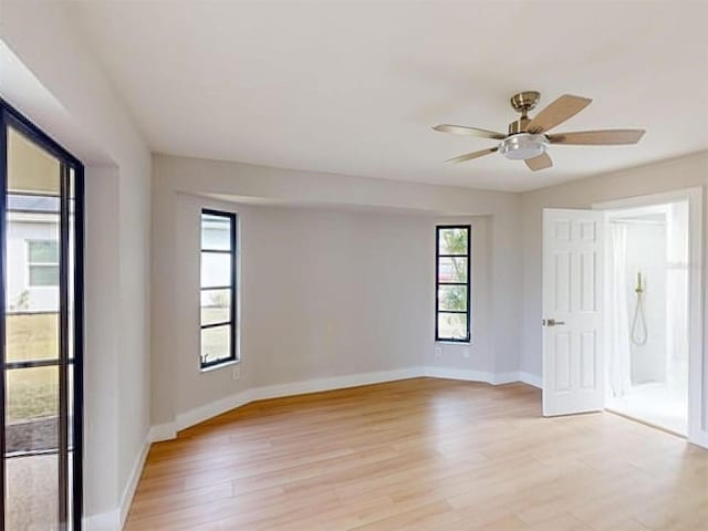 unfurnished room with ceiling fan and light hardwood / wood-style flooring