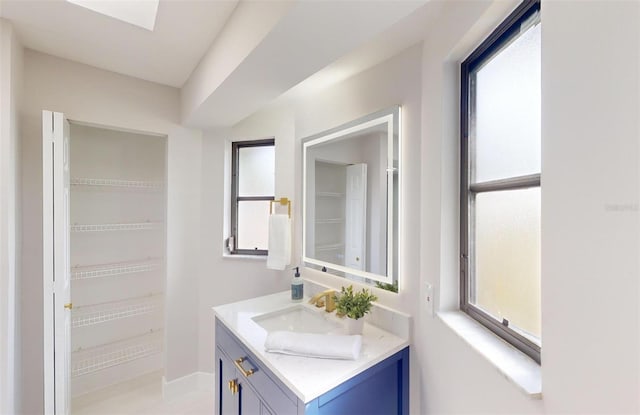 bathroom with vanity and a healthy amount of sunlight