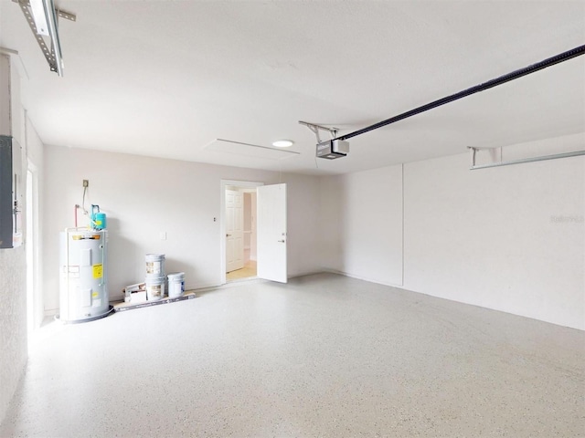 garage with electric panel, water heater, and a garage door opener