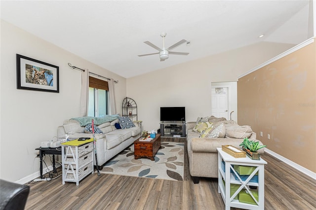 living room with ceiling fan, vaulted ceiling, and hardwood / wood-style floors