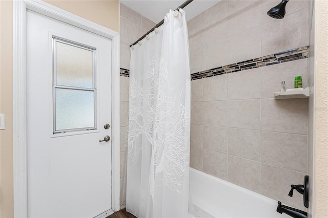 bathroom with shower / bathtub combination with curtain