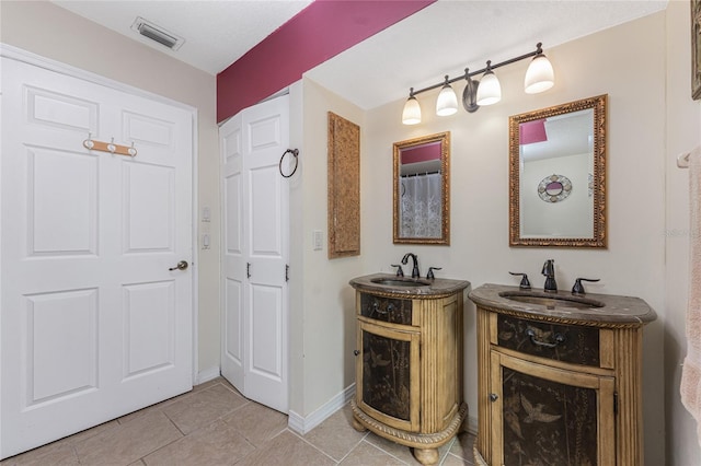 bathroom featuring tile patterned floors and vanity