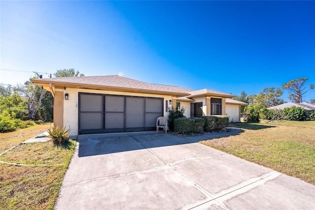 single story home with a garage and a front yard