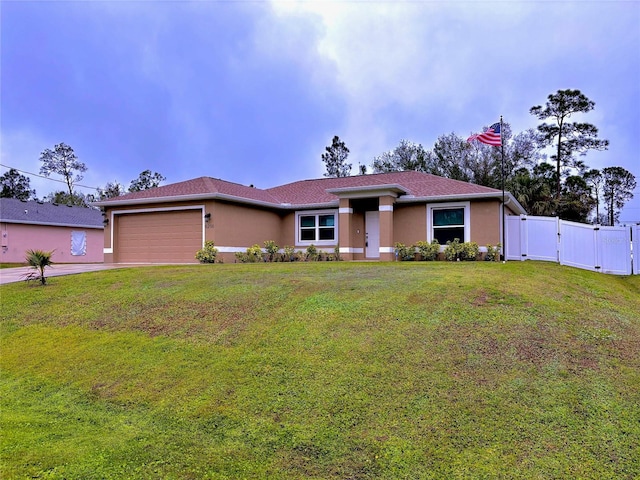 single story home with a garage and a front yard