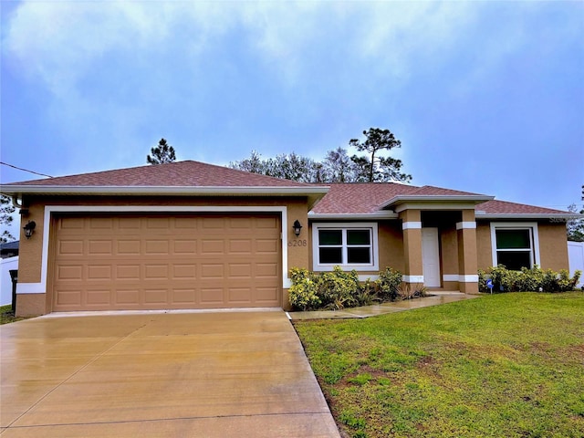 view of front of home featuring a garage and a front yard