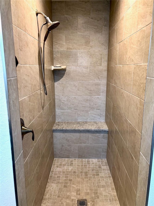 bathroom featuring tiled shower