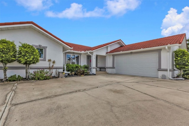 ranch-style home featuring a garage