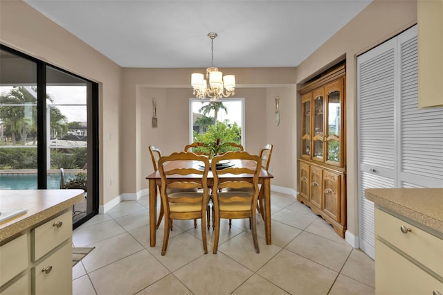 tiled dining area with a notable chandelier