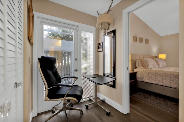 bedroom with access to exterior, dark hardwood / wood-style flooring, and lofted ceiling