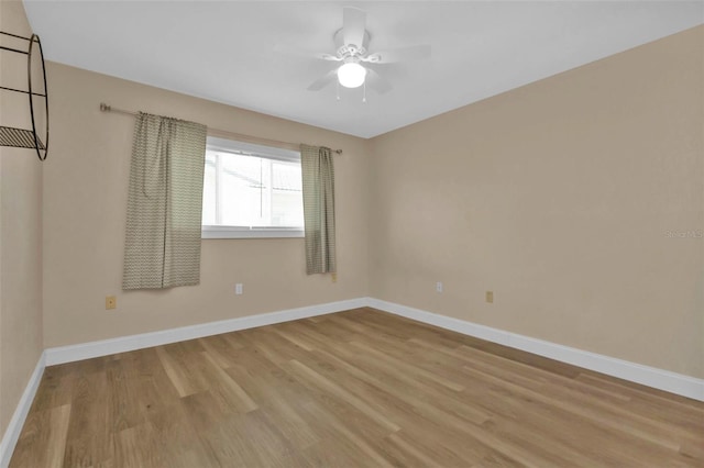 unfurnished room featuring light wood-type flooring and ceiling fan