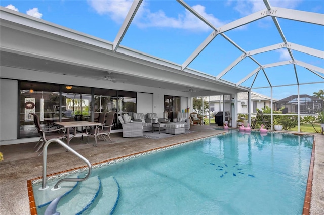 view of pool featuring ceiling fan, outdoor lounge area, a lanai, and a patio