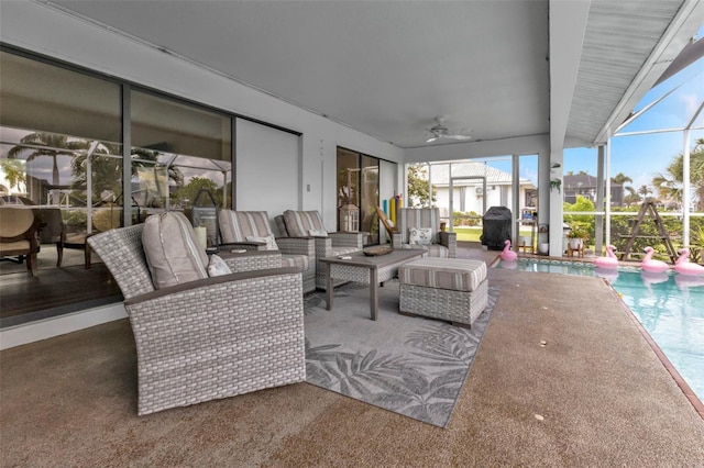 view of patio / terrace with ceiling fan, a lanai, and an outdoor hangout area