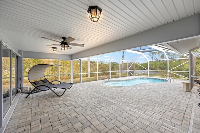 view of pool with a patio area, a lanai, and ceiling fan