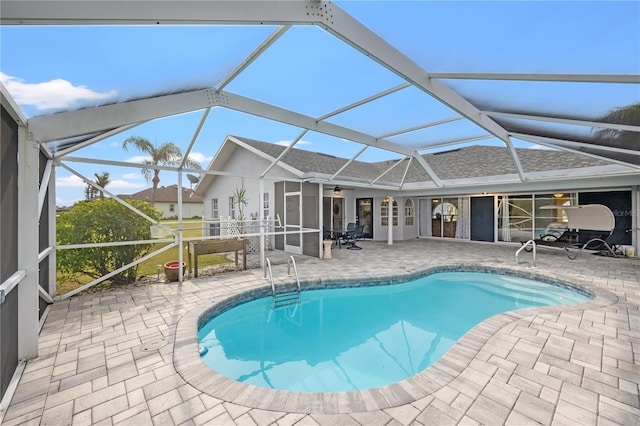 view of pool featuring a patio and a lanai