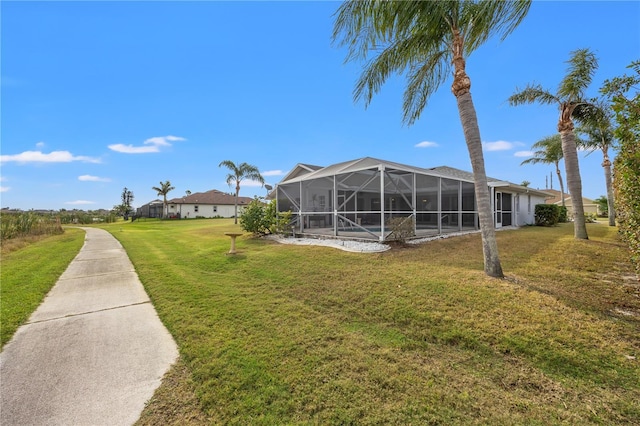 view of yard with a lanai