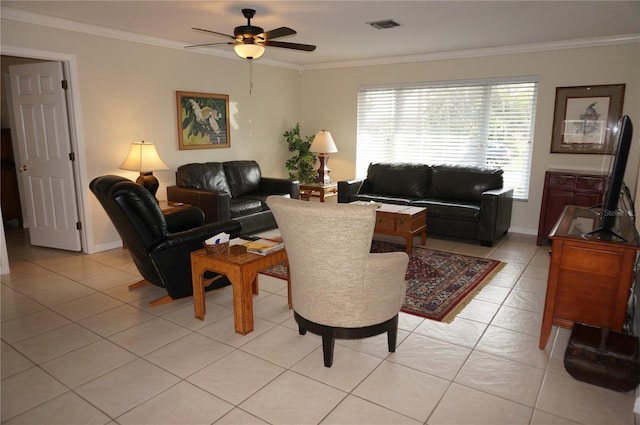 living room with ceiling fan, ornamental molding, and light tile patterned flooring