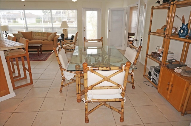 dining space with light tile patterned flooring