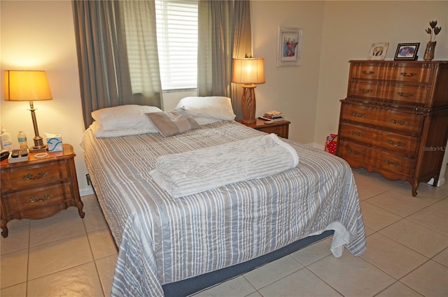 bedroom with light tile patterned floors