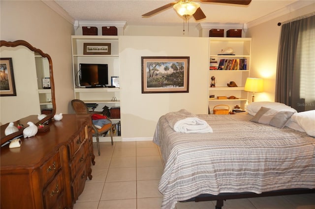 tiled bedroom featuring ceiling fan, a textured ceiling, and ornamental molding