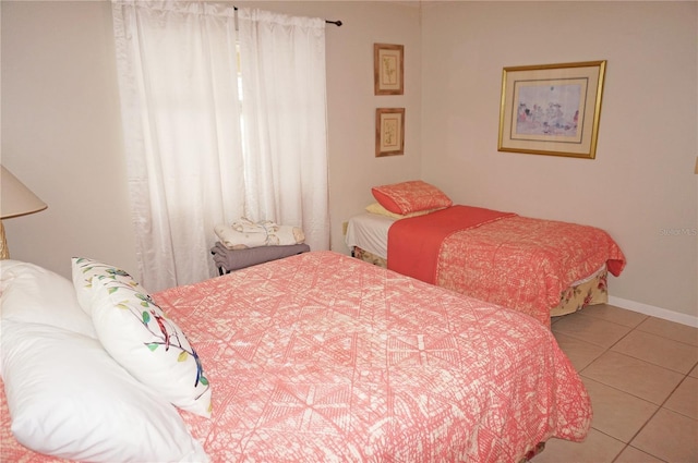 bedroom with light tile patterned floors