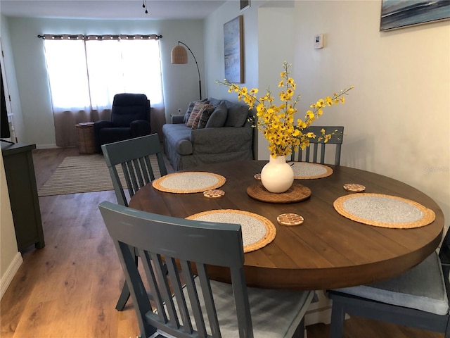 dining area featuring hardwood / wood-style floors