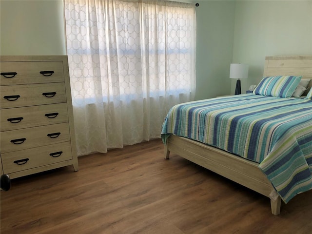 bedroom featuring dark hardwood / wood-style flooring