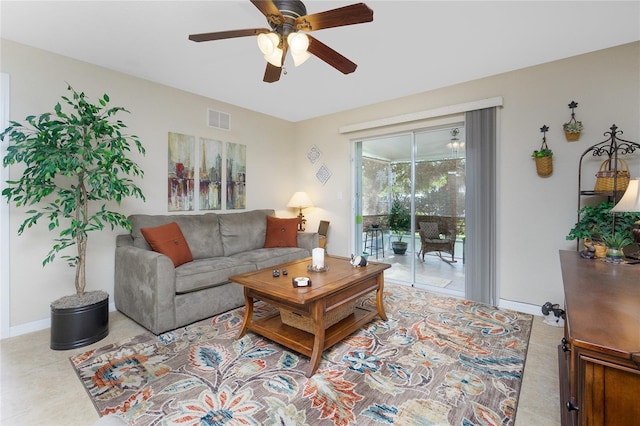 tiled living room featuring ceiling fan