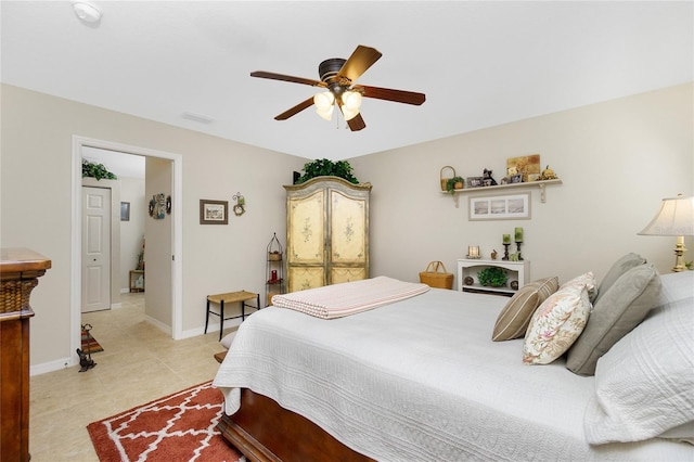 tiled bedroom with ceiling fan