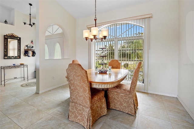 dining space with an inviting chandelier