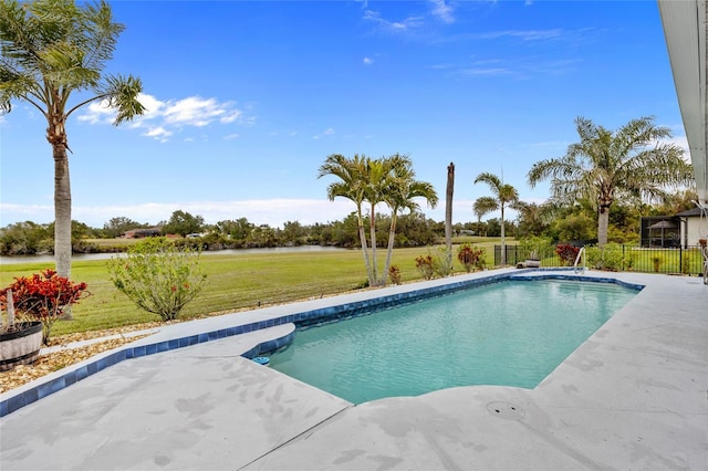 view of pool with a lawn and a patio area