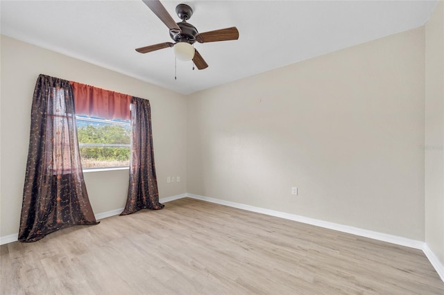 empty room with ceiling fan and light wood-type flooring