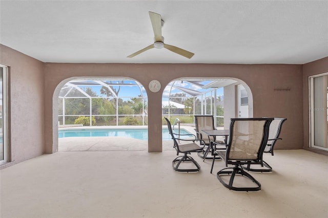 view of swimming pool featuring ceiling fan