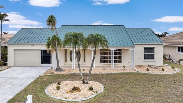 view of front of property with a garage and a front lawn