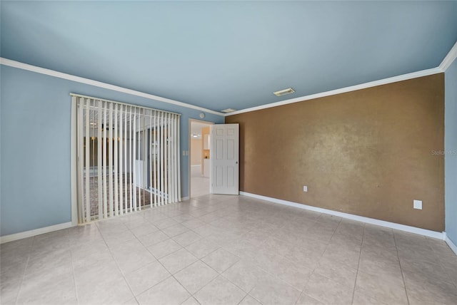 empty room featuring ornamental molding and light tile patterned floors