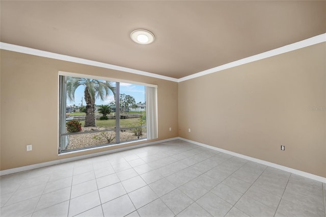 unfurnished room with crown molding and light tile patterned floors